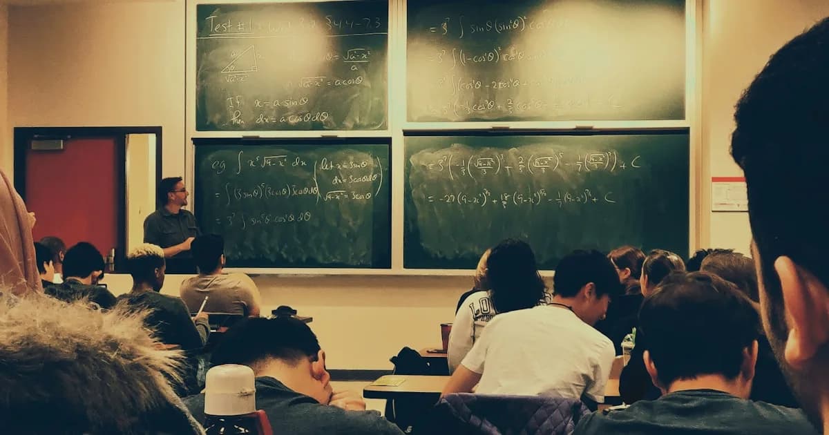 Artist sitting in front of blank canvas with stylus in hand